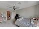 Bedroom with queen bed and en-suite bathroom at 8870 S Tenaya Way, Las Vegas, NV 89113