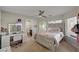 Bedroom with a queen bed, vanity, and en-suite bathroom at 8870 S Tenaya Way, Las Vegas, NV 89113