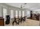 Bright breakfast nook with wooden table and chairs near kitchen at 8870 S Tenaya Way, Las Vegas, NV 89113