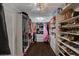 Large walk-in closet with ample shelving and hanging space at 8870 S Tenaya Way, Las Vegas, NV 89113