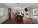 Large dining room with hardwood floors and a long table at 8870 S Tenaya Way, Las Vegas, NV 89113