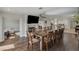 Open concept dining room with views into kitchen and living room at 8870 S Tenaya Way, Las Vegas, NV 89113