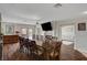 Bright dining room, hardwood floors, and a large table at 8870 S Tenaya Way, Las Vegas, NV 89113