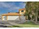Three-car garage and front view of two-story house at 8870 S Tenaya Way, Las Vegas, NV 89113