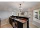 Modern home bar with wine cooler and ample storage at 8870 S Tenaya Way, Las Vegas, NV 89113