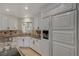 Kitchen features white cabinets, granite countertops, and stainless steel appliances at 8870 S Tenaya Way, Las Vegas, NV 89113