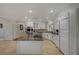 Spacious kitchen with granite island and white cabinets at 8870 S Tenaya Way, Las Vegas, NV 89113
