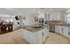 Spacious kitchen with granite countertops, stainless steel appliances, and white cabinets at 8870 S Tenaya Way, Las Vegas, NV 89113