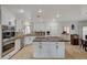 Modern kitchen with granite island and stainless steel appliances at 8870 S Tenaya Way, Las Vegas, NV 89113