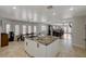 Open concept kitchen with large island, granite countertops, and stainless steel appliances at 8870 S Tenaya Way, Las Vegas, NV 89113