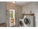Laundry room with washer, dryer, and exterior access at 8870 S Tenaya Way, Las Vegas, NV 89113