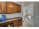 Laundry room with sink and upper cabinets at 8870 S Tenaya Way, Las Vegas, NV 89113