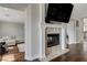 Living room with fireplace and hardwood floors at 8870 S Tenaya Way, Las Vegas, NV 89113