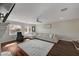 Living room with sectional sofa, hardwood floors and ceiling fan at 8870 S Tenaya Way, Las Vegas, NV 89113