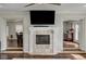 Spacious living room features a fireplace and hardwood floors at 8870 S Tenaya Way, Las Vegas, NV 89113