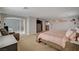 Main bedroom with a king bed, and a large ensuite bathroom at 8870 S Tenaya Way, Las Vegas, NV 89113