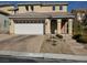Two-story home featuring a spacious two-car garage and a meticulously landscaped front yard at 9022 Sosa Creek Ave, Las Vegas, NV 89149