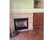 Stylish fireplace with stone surround and decorative mantel at 9022 Sosa Creek Ave, Las Vegas, NV 89149