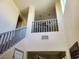 Grand foyer featuring soaring ceilings and an open staircase to the home's second story at 9022 Sosa Creek Ave, Las Vegas, NV 89149
