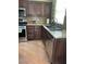 Kitchen features granite countertops, stainless steel appliances and wooden cabinets at 9022 Sosa Creek Ave, Las Vegas, NV 89149