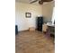 Office space with brown tile flooring, beige walls and basic work from home necessities at 9022 Sosa Creek Ave, Las Vegas, NV 89149