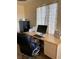 Close up of office space with beige walls, printer and desk at 9022 Sosa Creek Ave, Las Vegas, NV 89149
