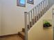 Beautiful staircase with gray railings and decorative wall art enhance the home's interior at 9022 Sosa Creek Ave, Las Vegas, NV 89149