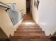 Stairway featuring tile flooring and a white banister leading to an upper level at 9022 Sosa Creek Ave, Las Vegas, NV 89149