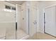 Bathroom boasting a clear glass shower, bright lighting, and a neutral color palette at 9661 Canyon Landing Ave, Las Vegas, NV 89166