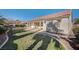 Spacious backyard featuring a covered patio and well-maintained lawn, perfect for outdoor entertaining at 9843 Wonderful Day Dr, Las Vegas, NV 89148