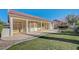 Expansive backyard with covered patio and lush lawn, perfect for outdoor living at 9843 Wonderful Day Dr, Las Vegas, NV 89148