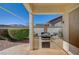 Backyard BBQ area on a covered patio, including counter space and built-in grill at 9843 Wonderful Day Dr, Las Vegas, NV 89148