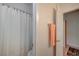 Clean bathroom with a shower tub, a towel bar and a view into another room at 9843 Wonderful Day Dr, Las Vegas, NV 89148