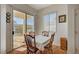 Bright dining area with sliding door access to the outdoor patio and backyard at 9843 Wonderful Day Dr, Las Vegas, NV 89148