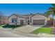 Charming single-story home with a well-manicured front yard, two car garage, and desert landscaping at 9843 Wonderful Day Dr, Las Vegas, NV 89148