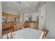 Spacious eat-in kitchen with warm wood cabinets, central island, and natural light at 9843 Wonderful Day Dr, Las Vegas, NV 89148