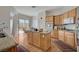 Well-appointed kitchen features granite countertops, a central island, and modern appliances at 9843 Wonderful Day Dr, Las Vegas, NV 89148