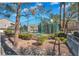 Community basketball court and lush landscaping surround the court at 2152 Quarry Ridge St # 106, Las Vegas, NV 89117