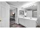 Bright bathroom featuring double sinks, modern fixtures, and an adjacent sitting room at 2152 Quarry Ridge St # 106, Las Vegas, NV 89117