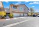 Exterior elevation with a three car garage and well-manicured landscaping at 2152 Quarry Ridge St # 106, Las Vegas, NV 89117