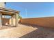 Private backyard with a covered patio and block wall at 10328 Apefly St, Las Vegas, NV 89141