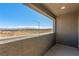 Covered balcony with distant mountain views at 10328 Apefly St, Las Vegas, NV 89141