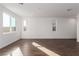 Bright living room with tile floors and large windows at 10328 Apefly St, Las Vegas, NV 89141