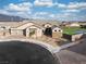 Expansive aerial view reveals a well-manicured home with a three-car garage and lush backyard in a serene neighborhood at 10420 Luella Ct, Las Vegas, NV 89143