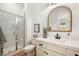 Modern bathroom with a walk-in shower, subway tile, sleek fixtures, and neutral decor at 10420 Luella Ct, Las Vegas, NV 89143