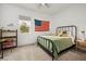 Comfortable bedroom with a metal bed frame, a ceiling fan, and natural light from the window at 10420 Luella Ct, Las Vegas, NV 89143