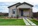 Charming home with a well-manicured lawn and stone accents on the facade at 10420 Luella Ct, Las Vegas, NV 89143