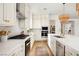 Bright kitchen featuring stainless steel appliances, marble countertops, and stylish fixtures at 10420 Luella Ct, Las Vegas, NV 89143