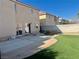 Backyard featuring artificial grass and a concrete patio at 10618 Timber Stand St, Las Vegas, NV 89183