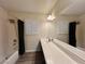 Bathroom with a tub/shower combination and a long vanity at 10618 Timber Stand St, Las Vegas, NV 89183